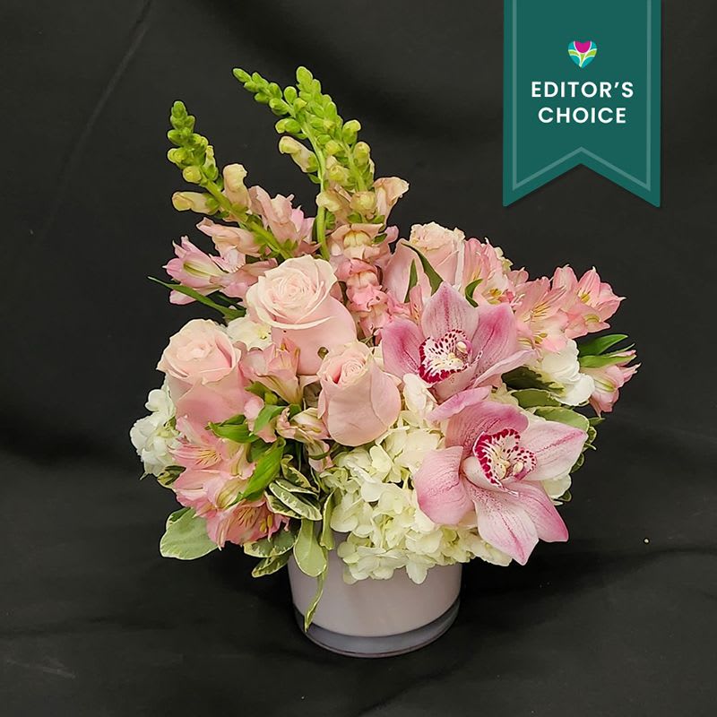 Pink Ombre - A Fabulous mix of Hydrangea, roses and cymbidium blooms.  Hand Designed in a beautiful color spotted ceramic.  This make s a wonderful gift and fits nicely on a desk or kitchen counter.  *Please note we have sold out of container posted in Standard size picture.  
