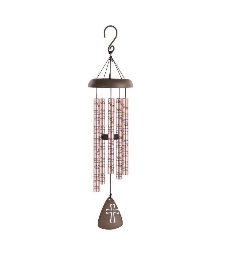 Hanging wind chime with pink tubes and a brown cross-shaped pendant