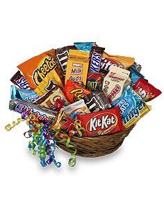 Basket of assorted candy bars with colorful curling ribbons