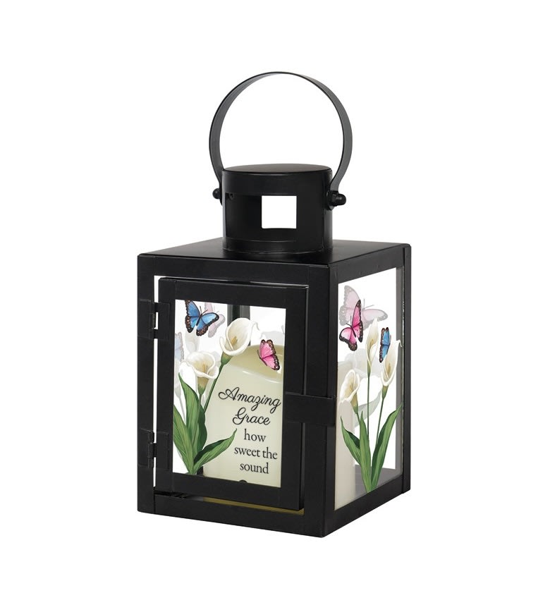 Black lantern with floral panels and the words Amazing Grace