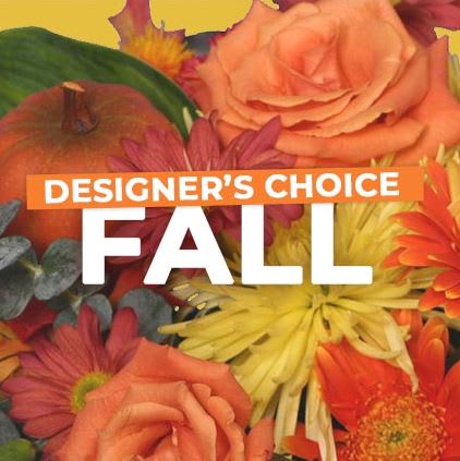 Fall floral arrangement with orange roses and yellow daisies
