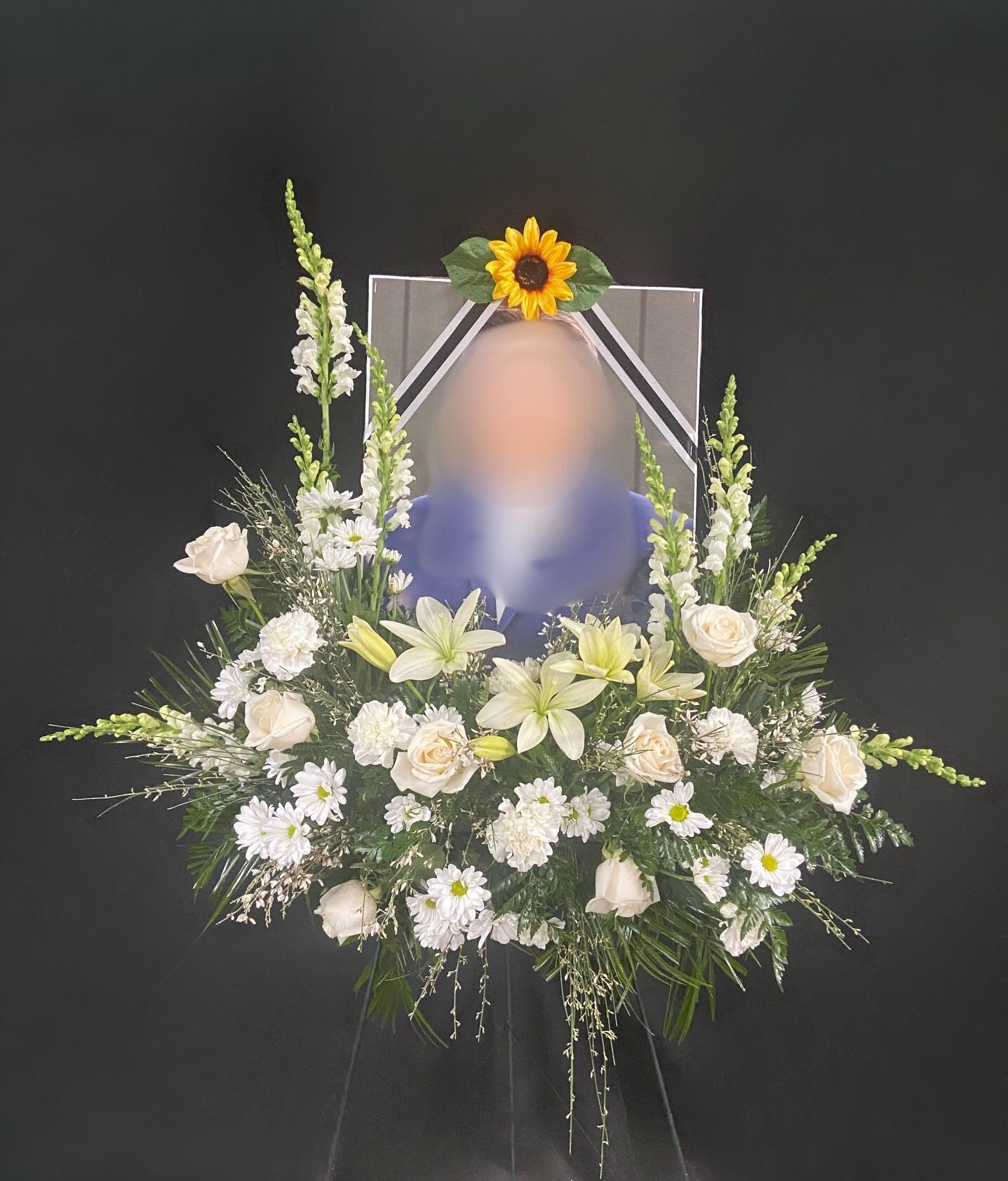 Purest Soul Picture Frame Accent Easel - A beautiful accent of all white flowers adorns a customer-provided picture of a loved one. Please discuss picture sizing dimensions when ordering (Recommended size approximately 16-18" W x 20-24" H). Picture and frame not included. Arrangement is mounted on a metal easel for prominent display.
