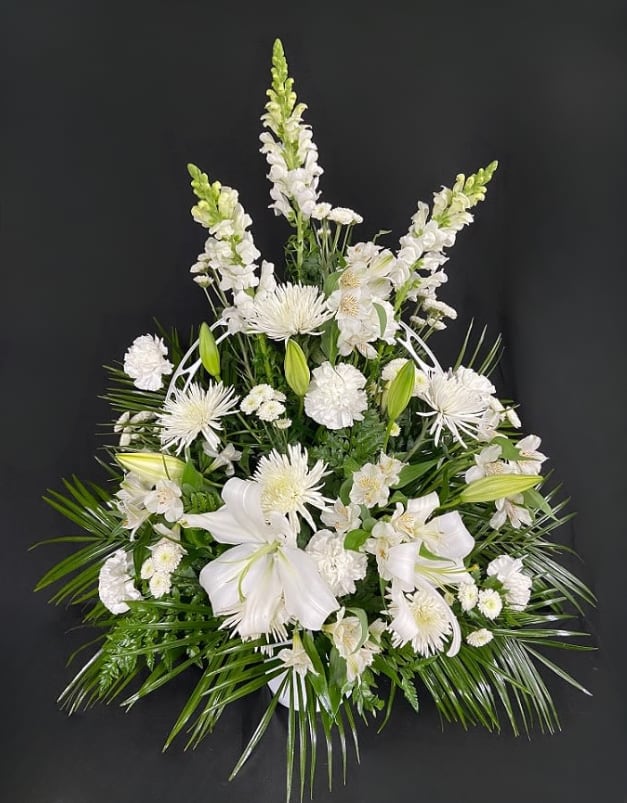 White floral spray with lilies and tall snapdragons