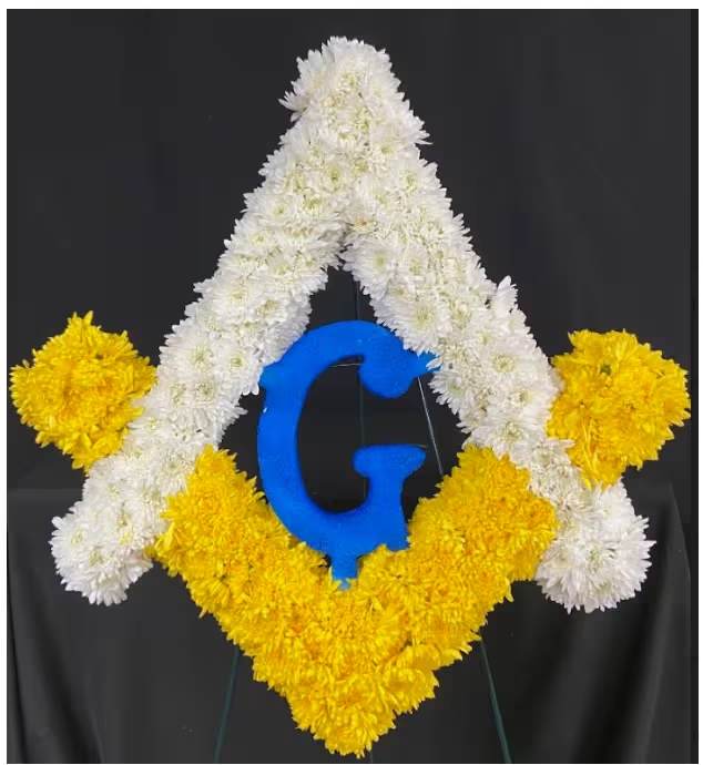 Masonic Emblem - 24" Masonic Emblem mounted on a 54" Easel. White, Yellow, and Blue Mums or Carnations (depending on availability)