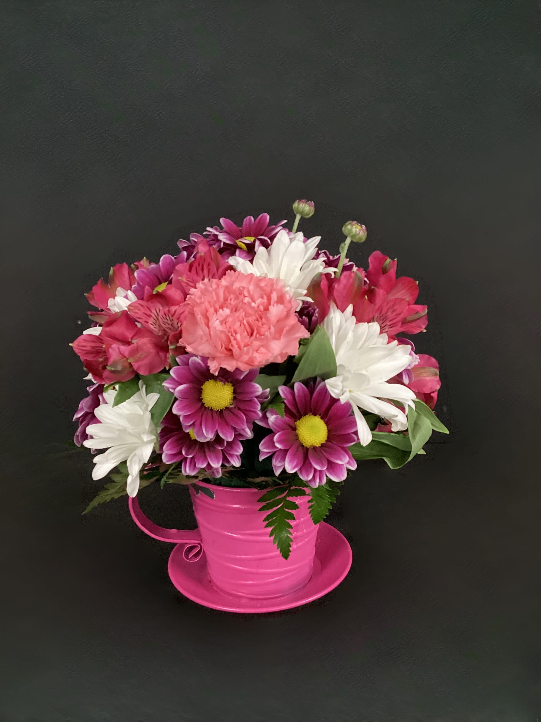 Teacup O' Delight - This cute metal teacup comes in several colors (Green, Purple, Orange, Red, Pink &amp; Yellow) and is overflowing with beautiful accent flowers such as carnations, daisies, alstroemeria. Color assortment will vary, please enter any requests in the SPECIAL INSTRUCTIONS box when ordering!