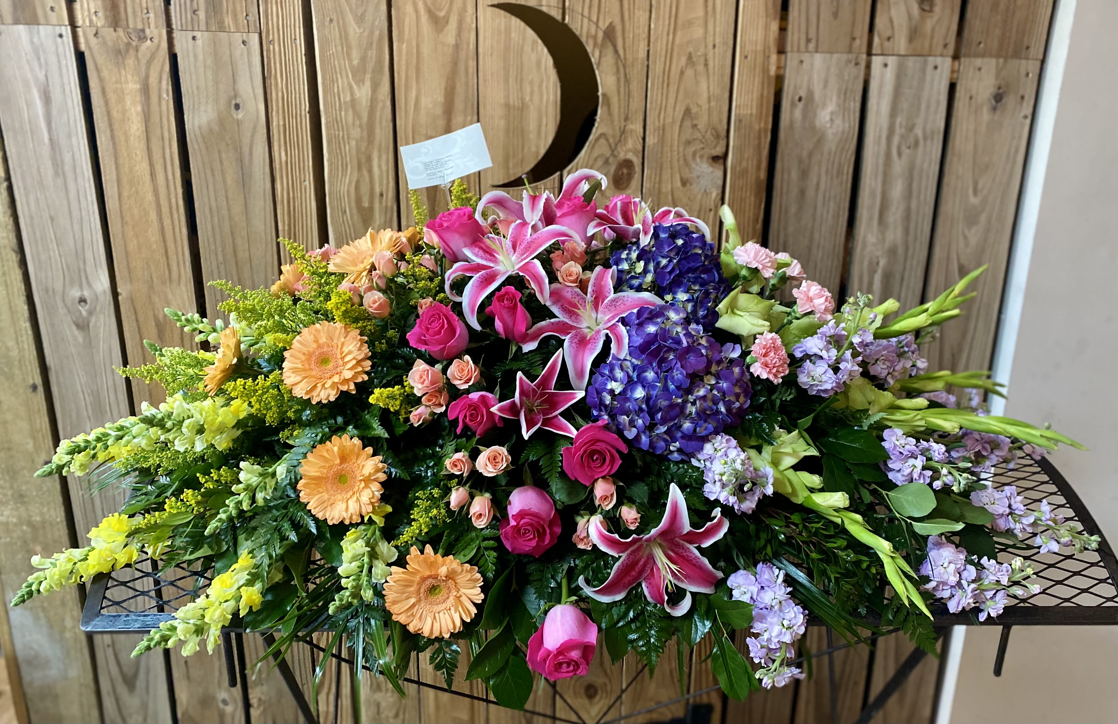 Large mixed floral spray with lilies, roses, hydrangeas, and gerbera daisies