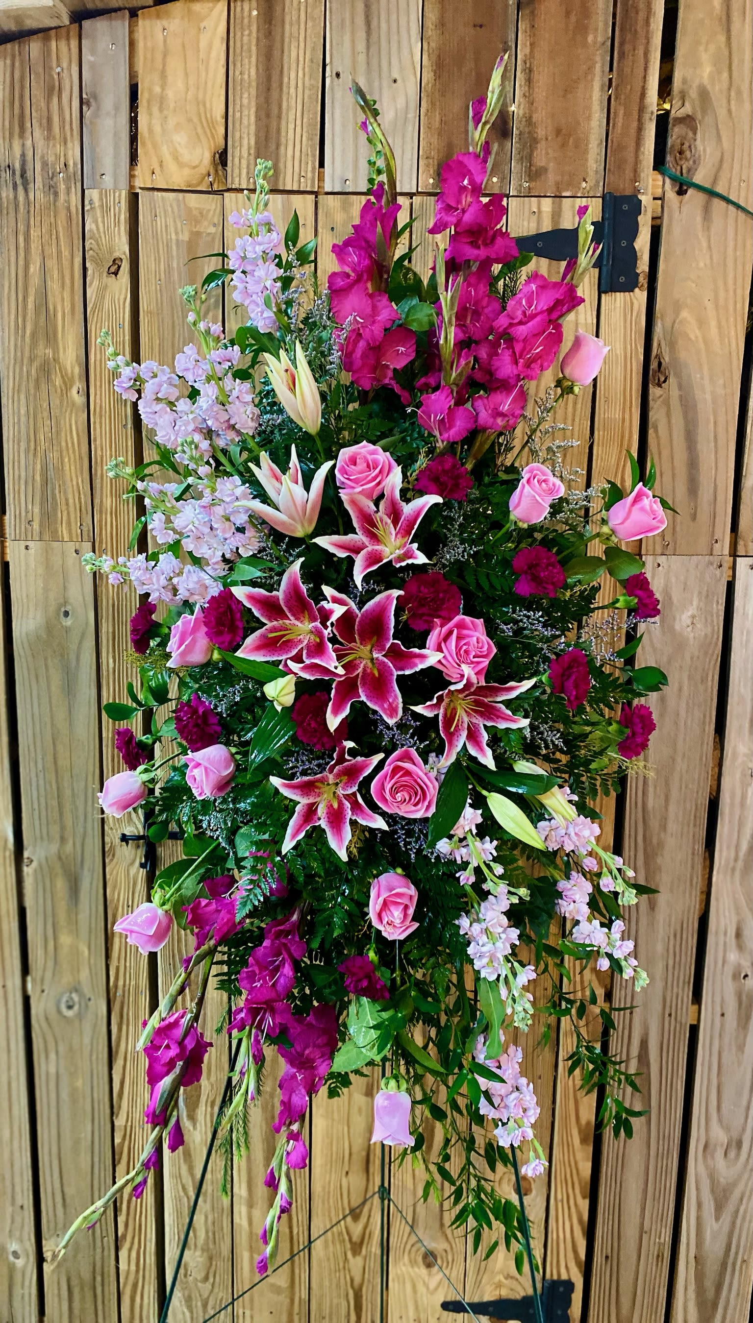 Tall standing floral spray with pink lilies and roses