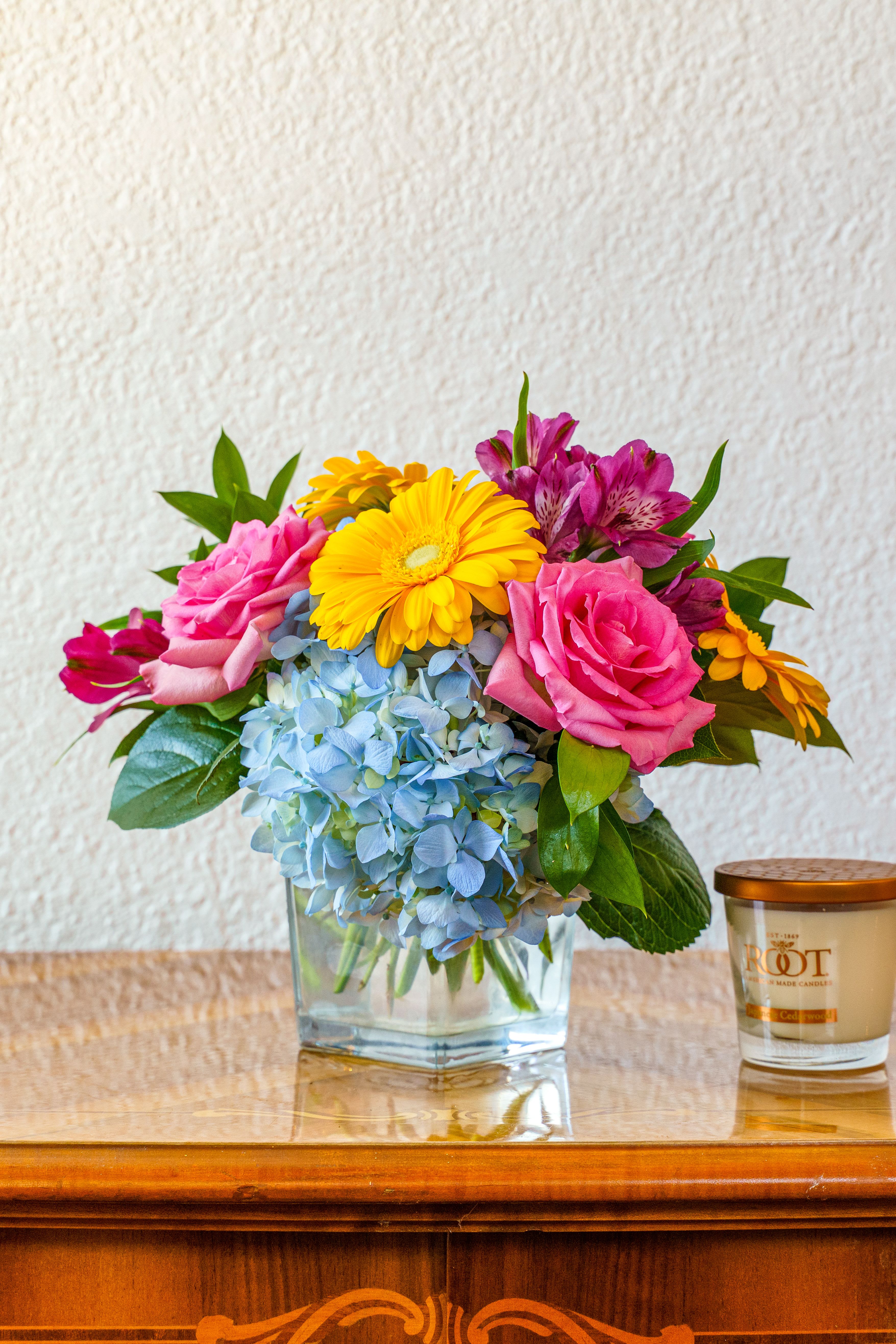 Summer Sunshine - This warm and inviting arrangement is the perfect breath of fresh air! Bring a little summertime to them no matter the season. Perfect for Mother's Day, a birthday, or a warm congratulations.