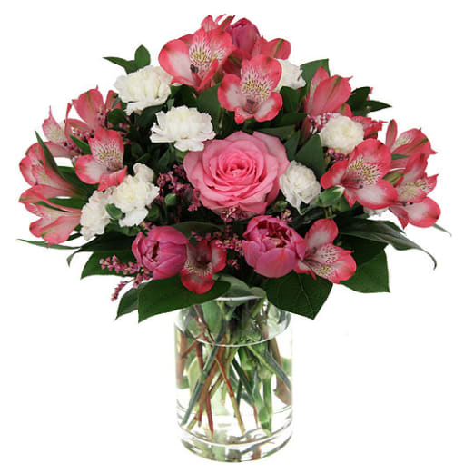 Pink and white mixed bouquet in a clear glass vase