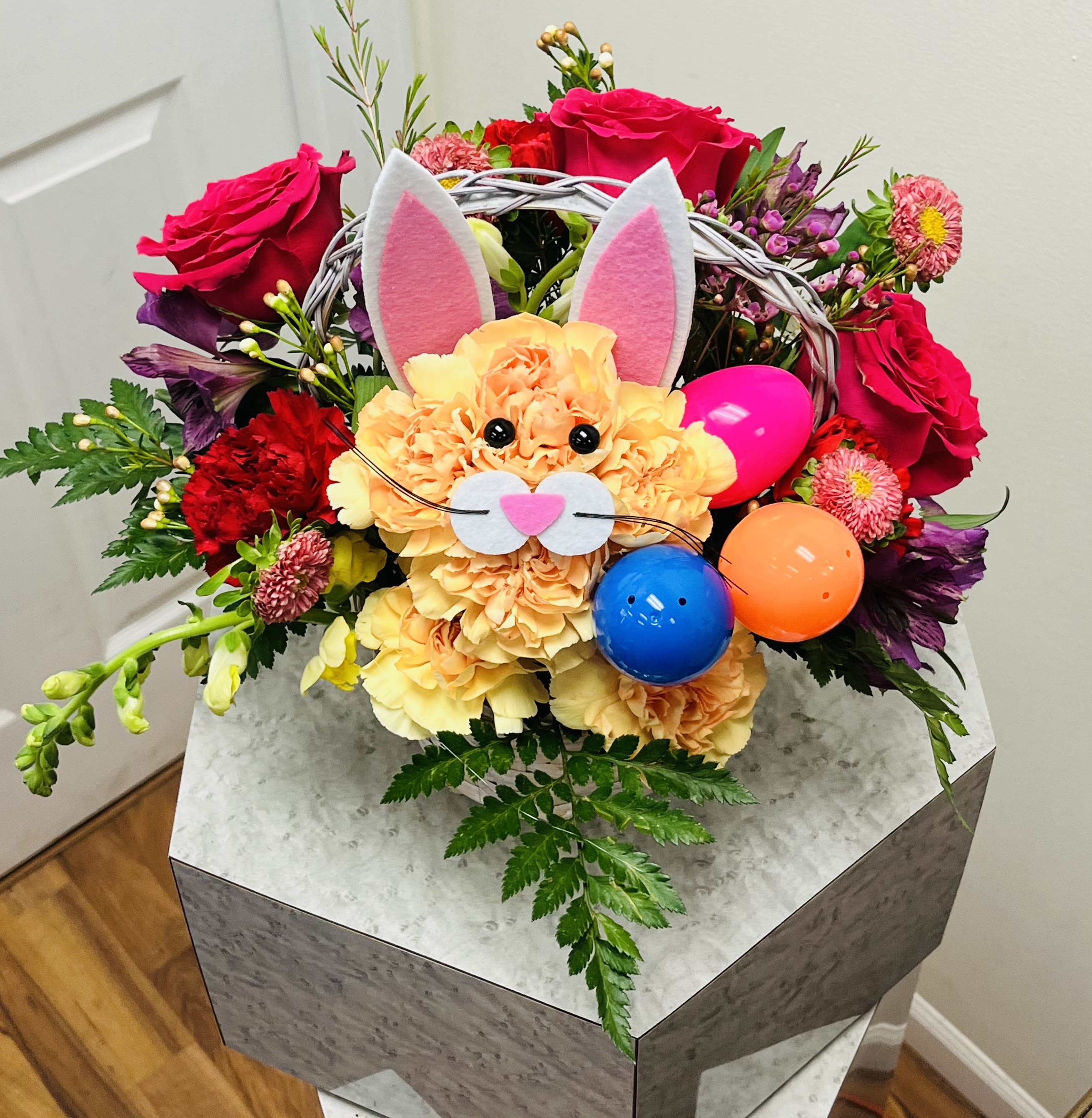 One Bunny Basket  - Bunny will be made in a pastel color we will add easter eggs to the basket. It will have roses and fillers.  *You can add on small candy we do have "peeps" Make it special for that loved one. 6''-8'' basket 