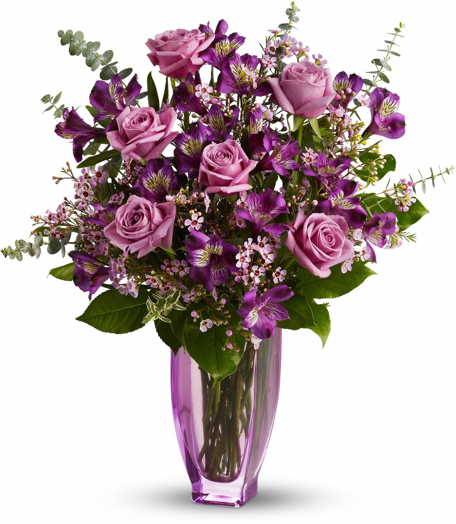 Purple roses and alstroemeria in a tall purple glass vase