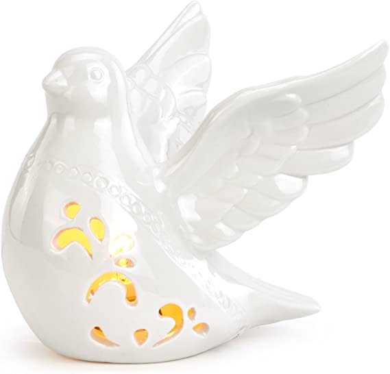 White ceramic dove figurine with wing details and yellow cutout accents
