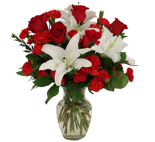 My One and Only - Enter fully into romance anytime of the year with our popular "My One and Only" bouquet, featuring a classic combination of red and white blooms arranged in a clear glass vase. Red roses combine with white lilies, red carnations and red miniature carnation. Happy Romance!