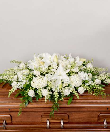 Peace Casket Spray  - An elegant casket spray of all premium blooms - including orchids, hydrangea, roses, and lilies - in peaceful shades of white and creams that can be placed on either an open or closed casket
