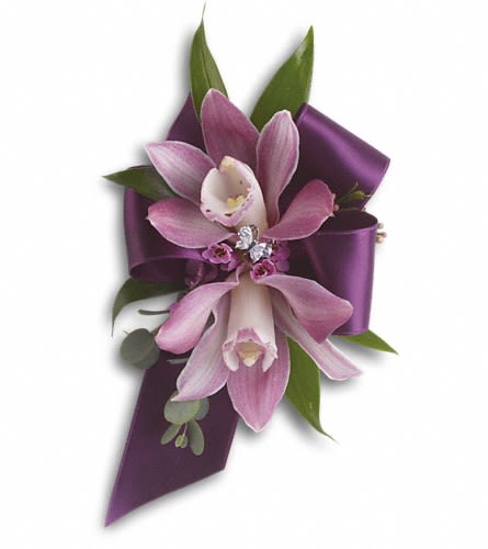 Purple orchid corsage with ribbon and green leaves