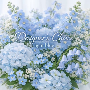 Light blue floral arrangement with hydrangeas and small blue blossoms