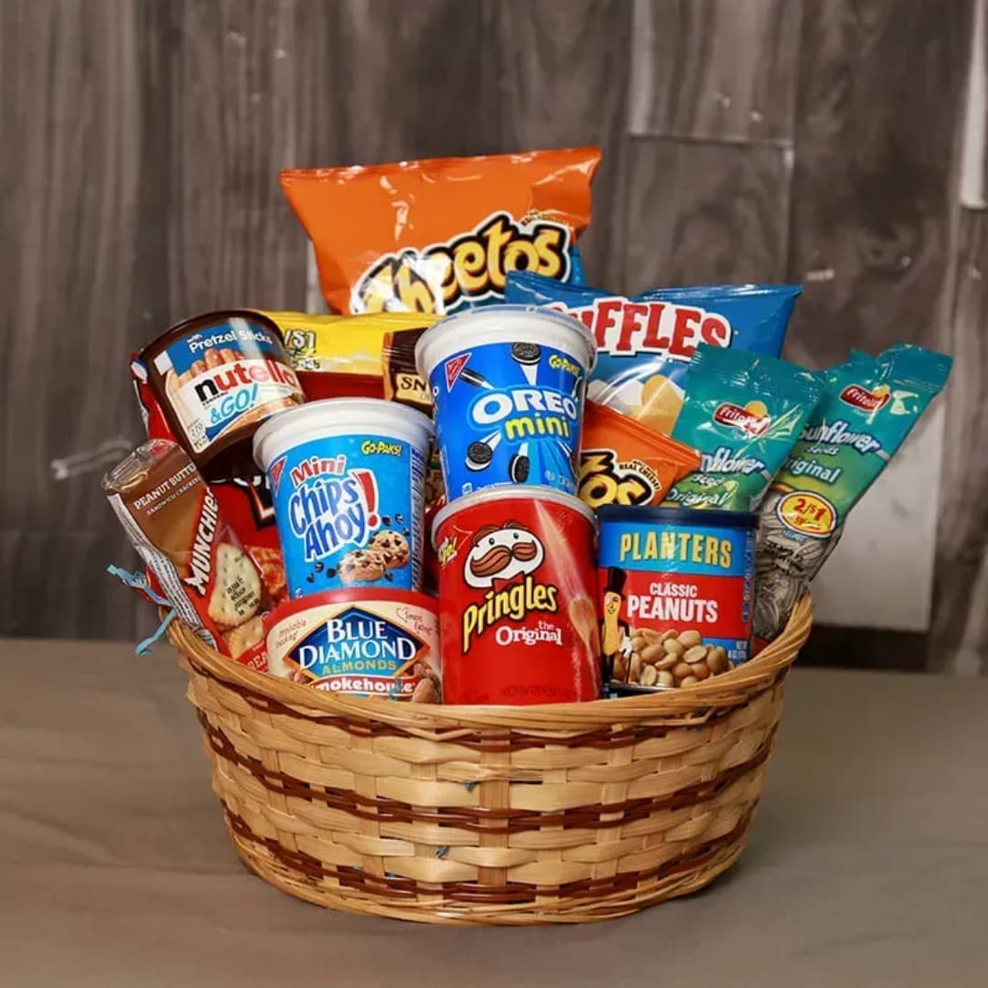 Basket filled with assorted snack packs and candy cups