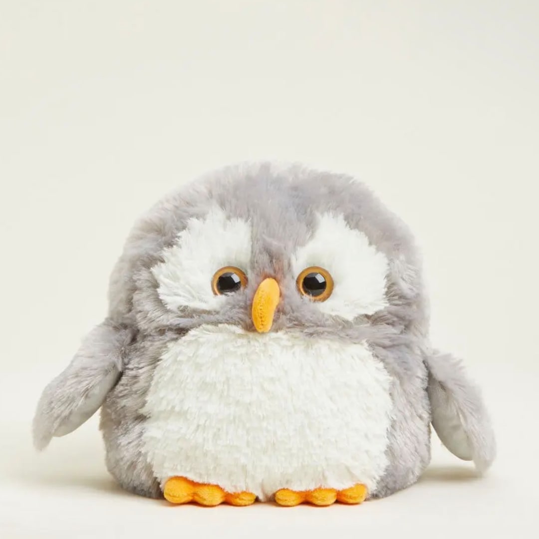 Plush owl toy with gray and white fur and orange beak and feet