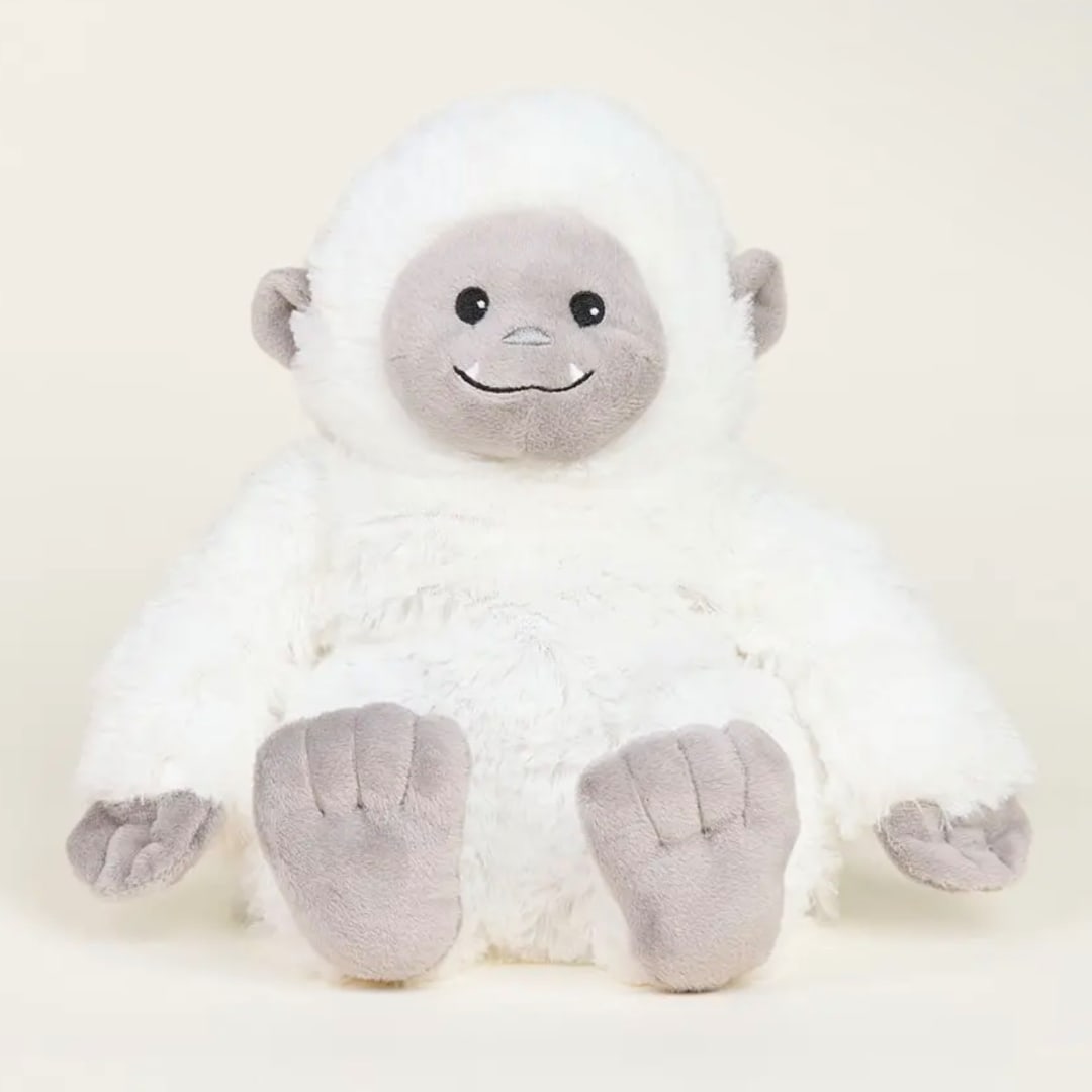 White plush stuffed animal with a gray face and feet