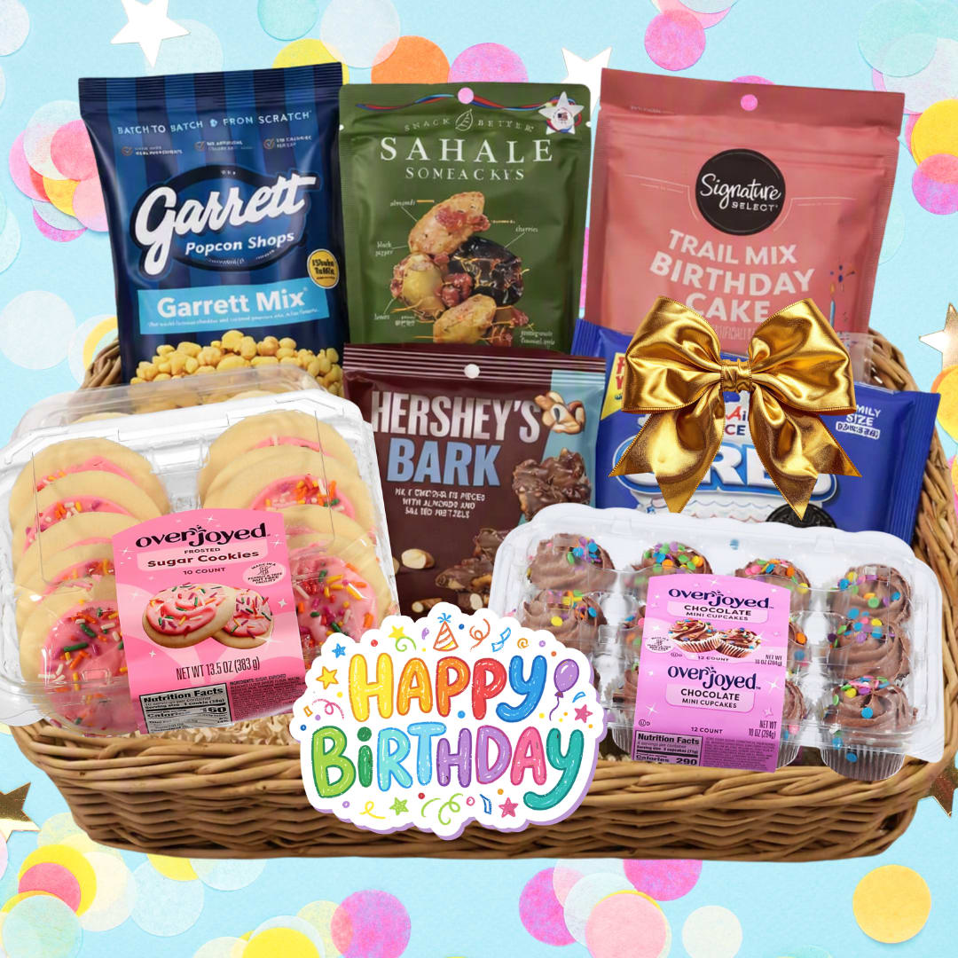 Birthday gift basket with snacks, cookies, cupcakes, and a happy birthday sign