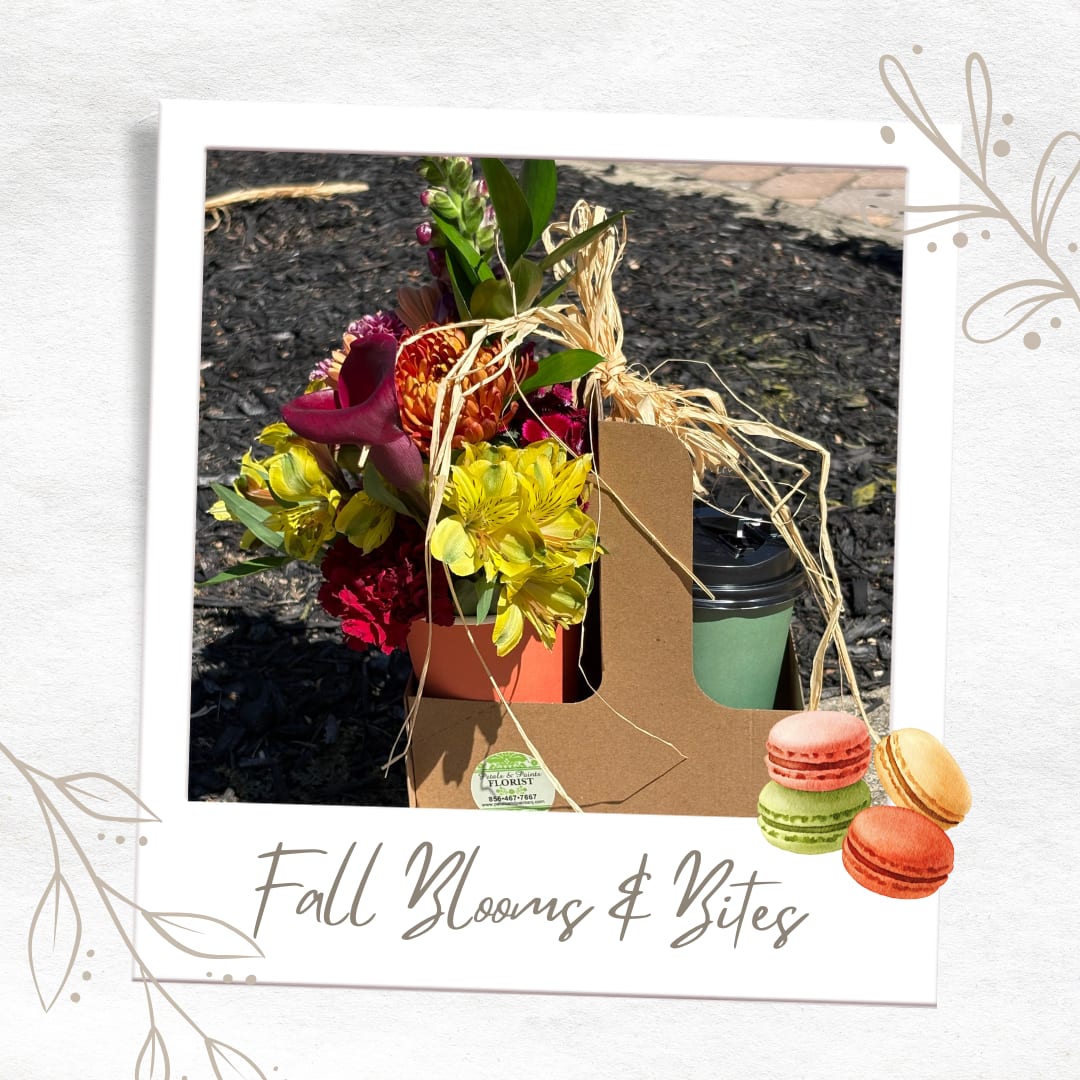 Fall flower arrangement with a coffee cup and macarons in a gift box