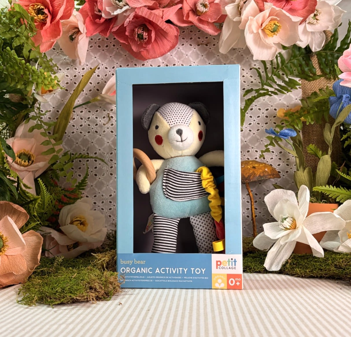 Organic Busy Bear Activity Toy - Your little one will be one busy bear with this Organic Baby Activity Toy from Petit Collage! Completely handmade, your little one will love teething the beech wood ring and cuddling its crinkly shape.  • Entertains with gentle developmental activities • Constructed with the highest quality GOTS certified organic cotton and non-toxic dyes • Filled with certified recycled polyester made from water-bottles • Activity toy measures 10.25" H x 6" L x 2.75" W • Designed for newborns and ages 0+