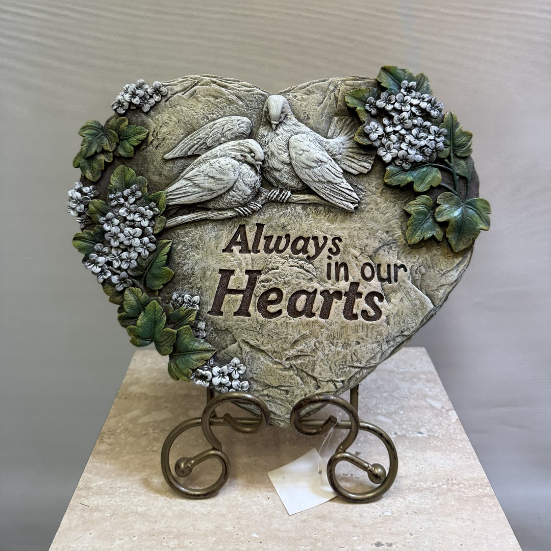 Heart-shaped memorial plaque with two birds and floral accents