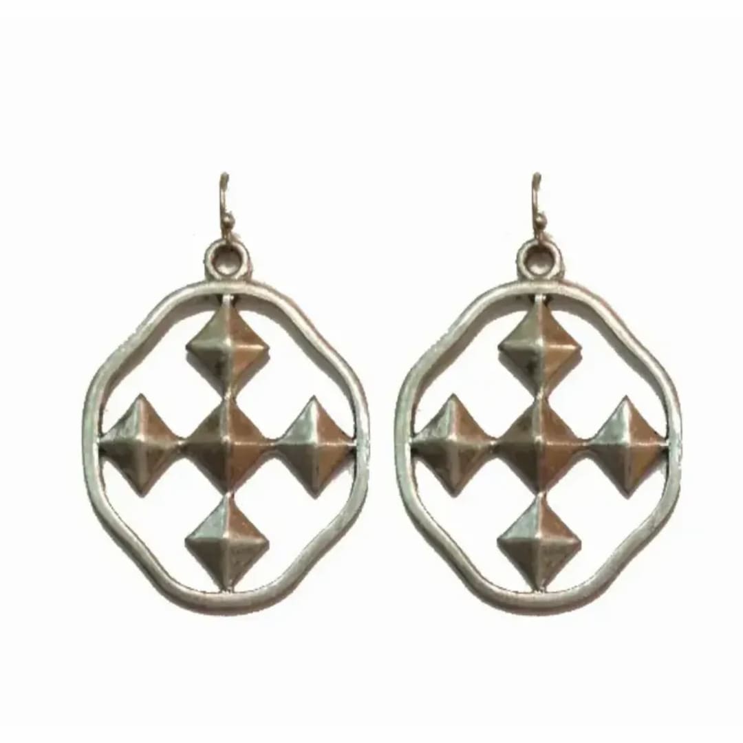 Pair of silver geometric drop earrings with pointed metal accents