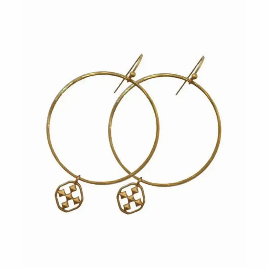 Pair of gold hoop earrings with small dangling charms
