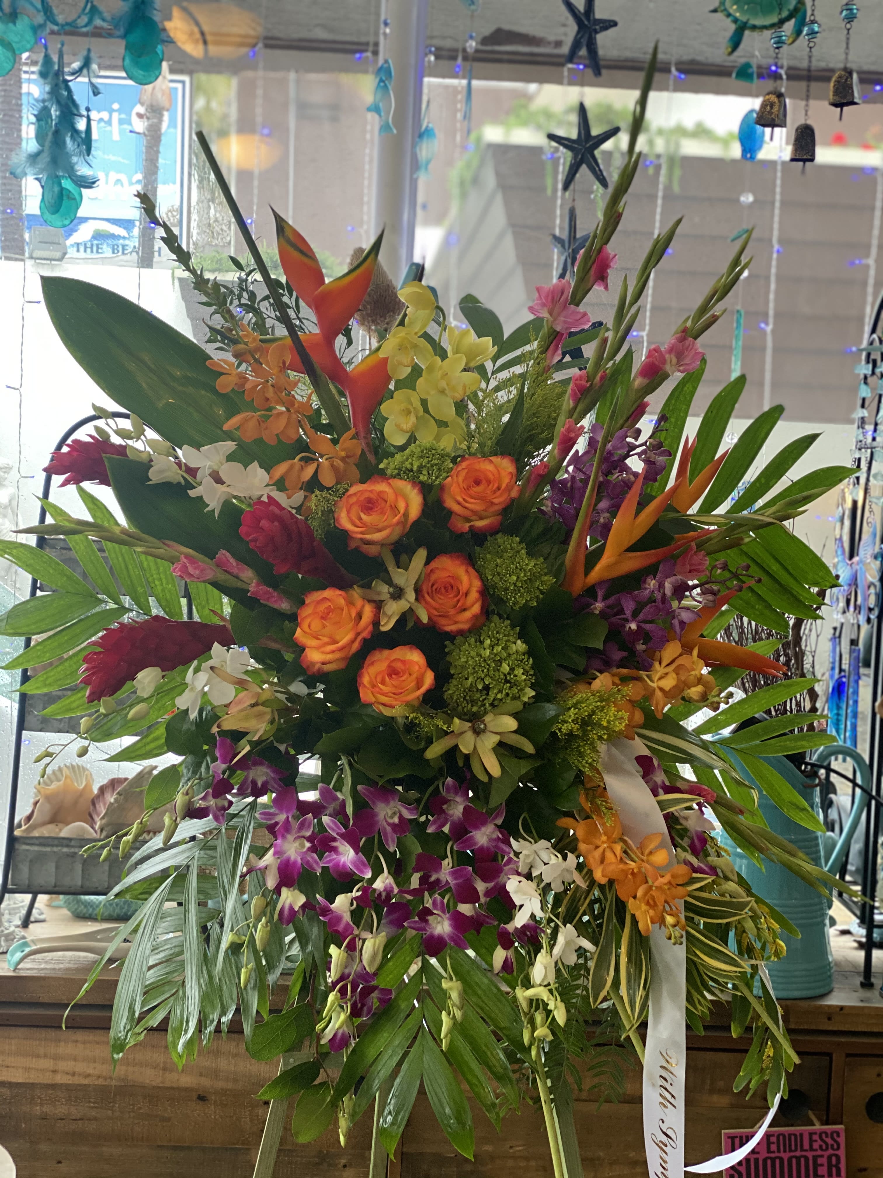 Large tropical bouquet with orange roses and purple orchids