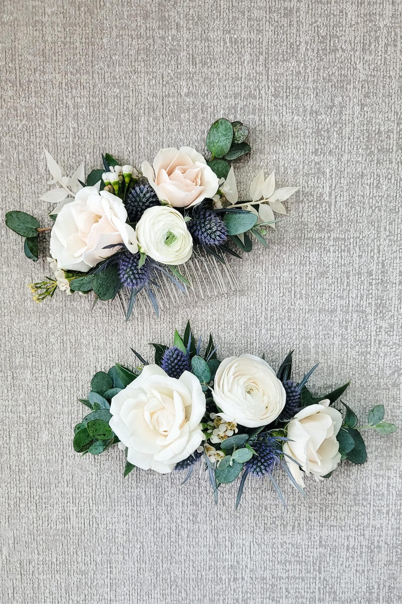 Two floral hair combs with white roses and greenery