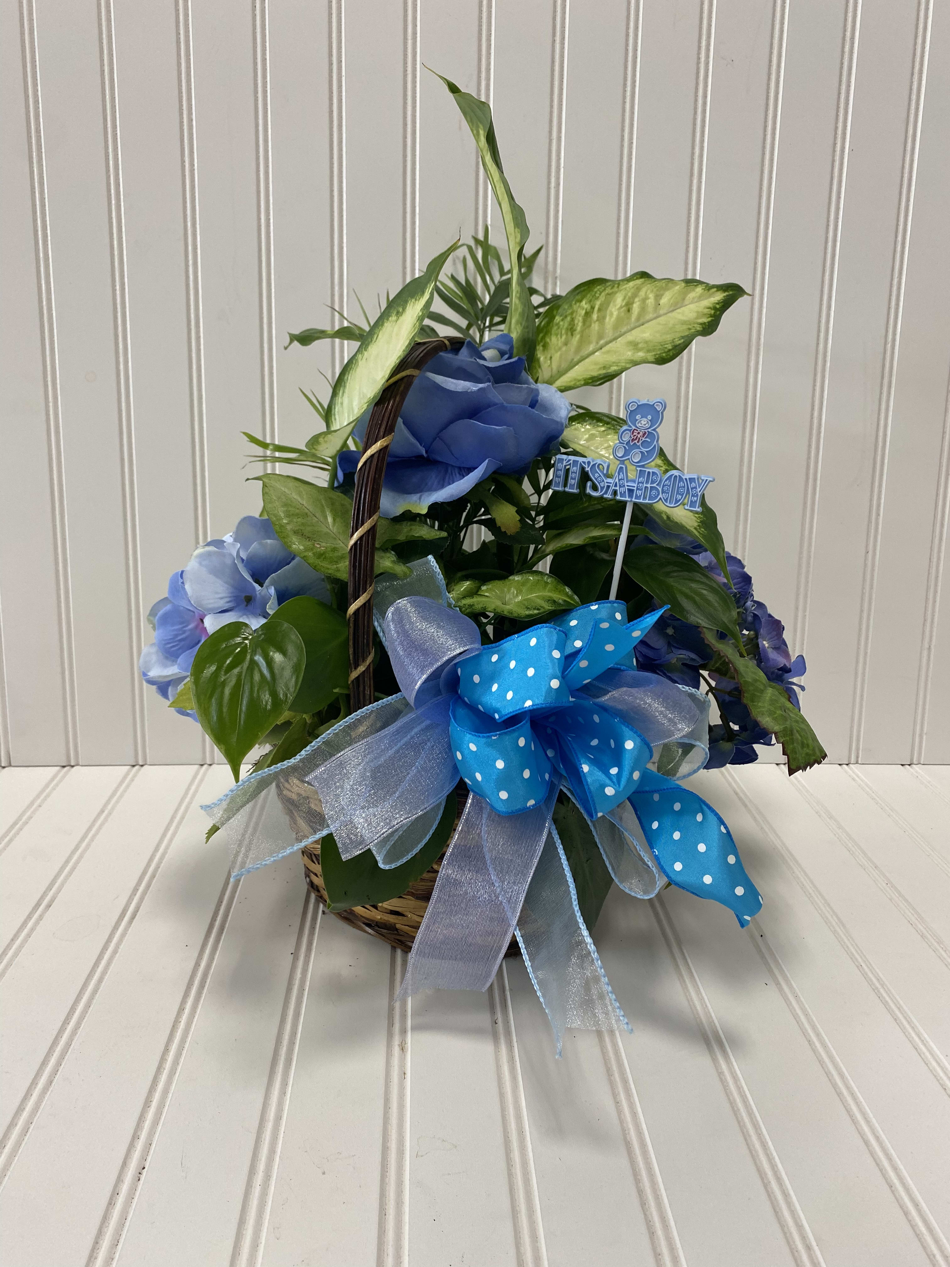 Blue floral basket with a baby boy pick and ribbon bow
