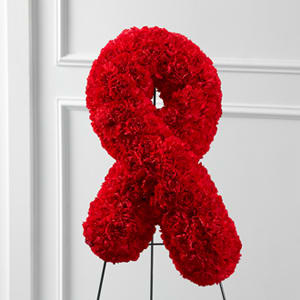Red carnation ribbon on a stand