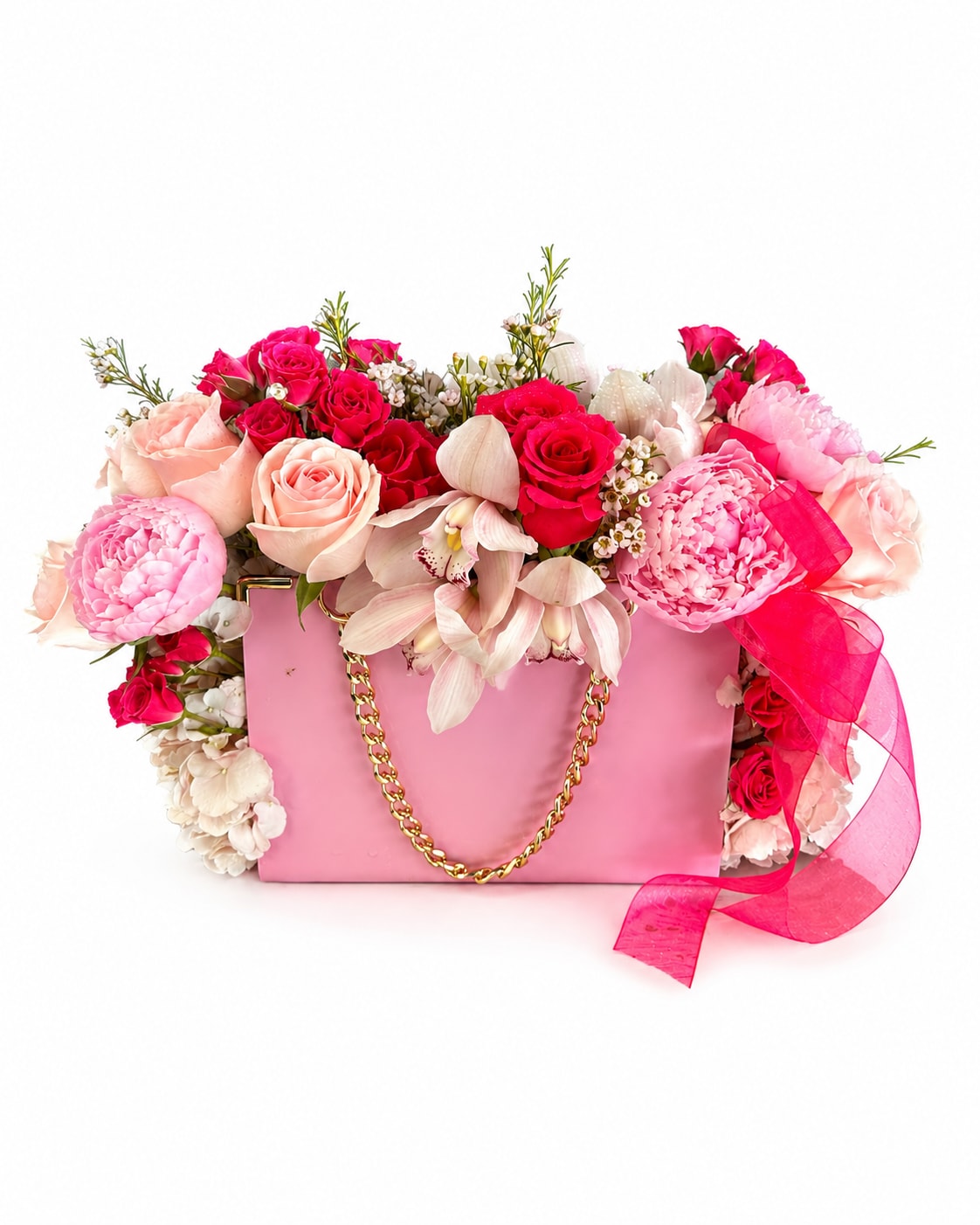Mom's Pink Purse - A charming arrangement of lush pink roses, peonies, orchids, and fillers beautifuly arranged in a chic pink purse shaped container with a gold chain handle and pink ribbon. Perfect for Mom feel loved and appreciated on her special day. 