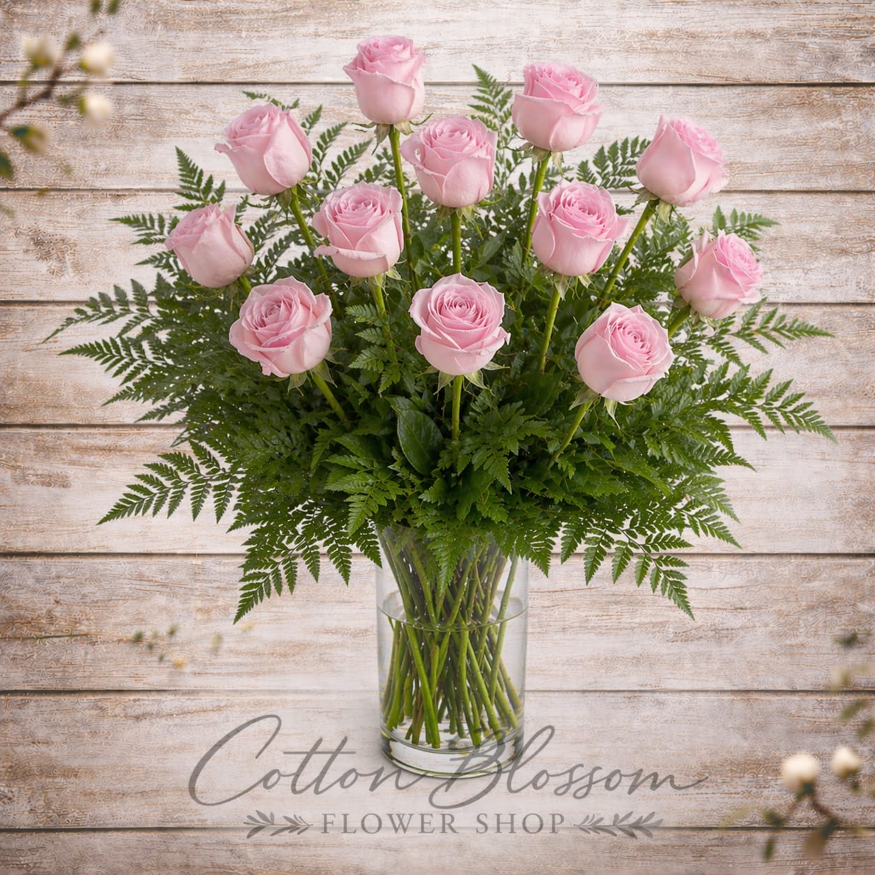 One Dozen Pink Roses - One Dozen Pink Roses – Elegant Rose Delivery in Maricopa, AZ    Pretty, pink, and perfectly romantic. There’s nothing quite like long-stemmed pink roses to express admiration, gratitude, and affection.    This timeless arrangement features one dozen premium long-stemmed pink roses accented with fresh greenery and beautifully arranged in a classic clear glass vase. Soft, elegant, and full of charm, it’s the perfect gift for anniversaries, birthdays, thank you moments, new beginnings, or simply to brighten someone’s day.    Cotton Blossom Flower Shop proudly offers same-day flower delivery in Maricopa, Casa Grande, and Stanfield, Arizona. Each bouquet is hand-designed with care using the freshest quality roses and arranged in our signature style.    Order online today and send a graceful expression of love from your trusted local Maricopa florist.