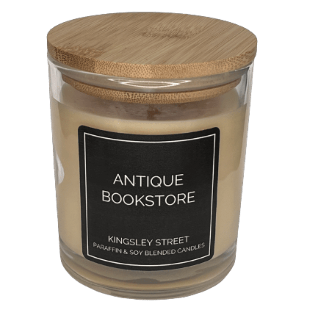 Scented candle in a glass jar with a wooden lid and black label