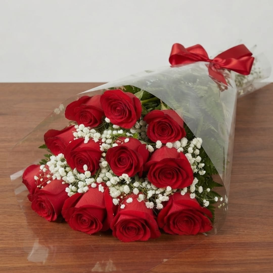 Bouquet of red roses with white baby's breath in clear wrap