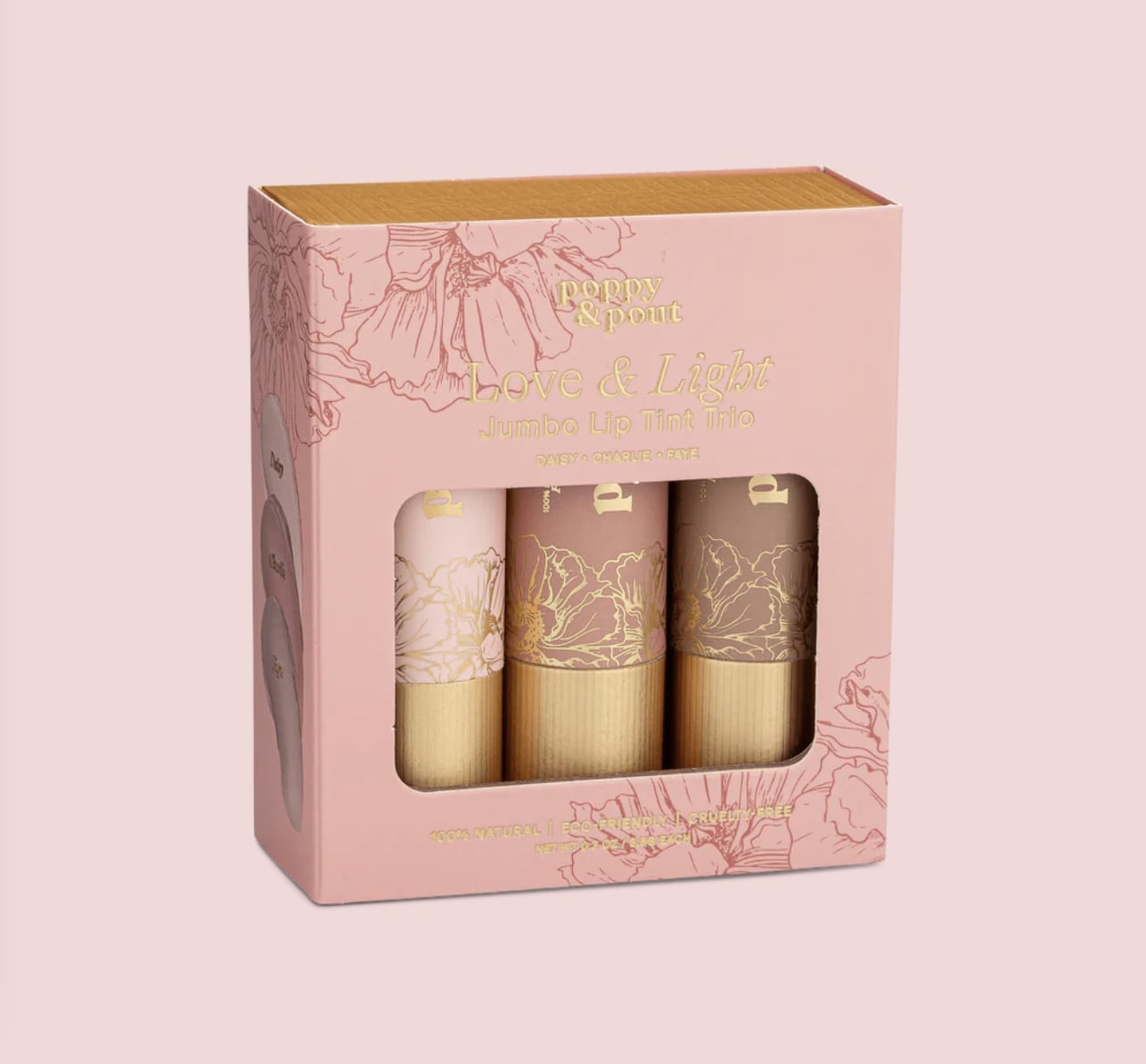 Pink boxed set of three jumbo lip tints with floral illustrations and a clear window.