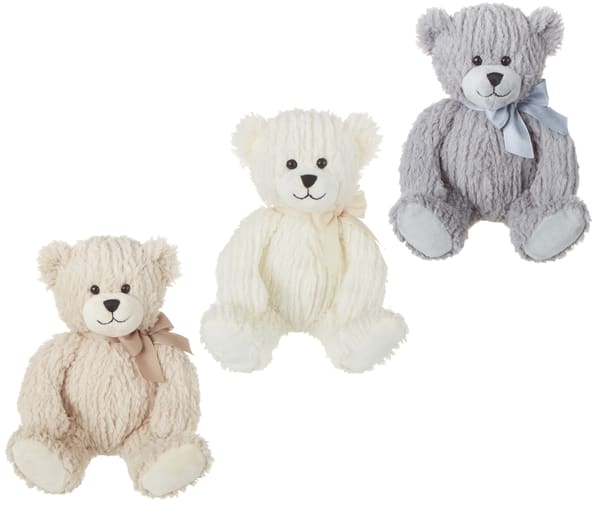 Three plush teddy bears in cream, white, and gray with ribbons