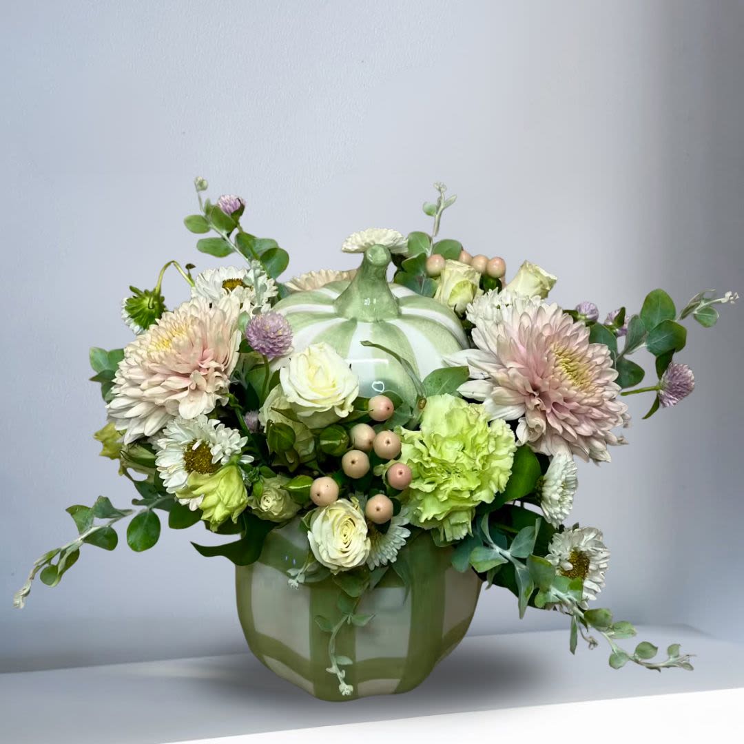 You're Sweet in Pumpkin Cookie Jar - Recipe: Pink Crysthemums, White Spray Roses, White Matsumoto, Hypericum Berries, and Eucalyptus in a short green plaid pumpkin, ceramic cookie jar pot with lid. Availability: Autumn Orientation: All Facing View Photo shown: Standard