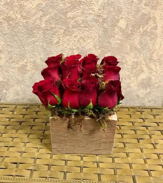 Wooden Box Red Roses with Moss - Type of Flowers: Red Roses and moss in a handmade, reusable, wooden box. Availability: All year round Substitute Available: Yes Design View: All Sided Facing View Photo shown: Regular 