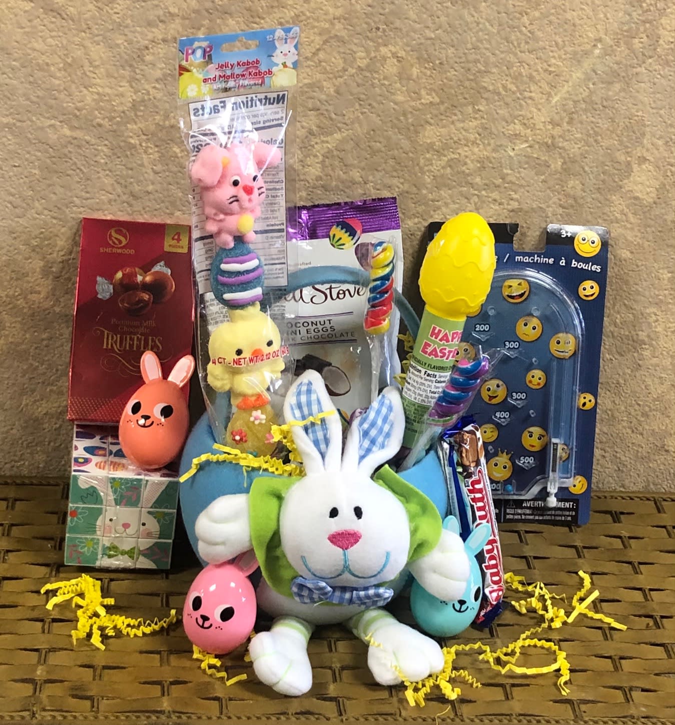 Easter Bunny Goodies - Easter candy and toys in a cute fabric Easter-themed basket. Please specify if it for a boy or girl. Only available Easter Week