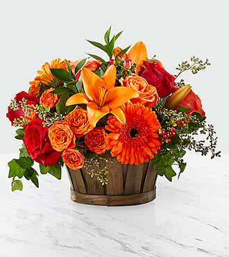 Fall Sunset - Give a gift that will leave a lasting smile on their face. With red roses, orange spray roses, orange gerbera daisies, and an assortment of lush greens.