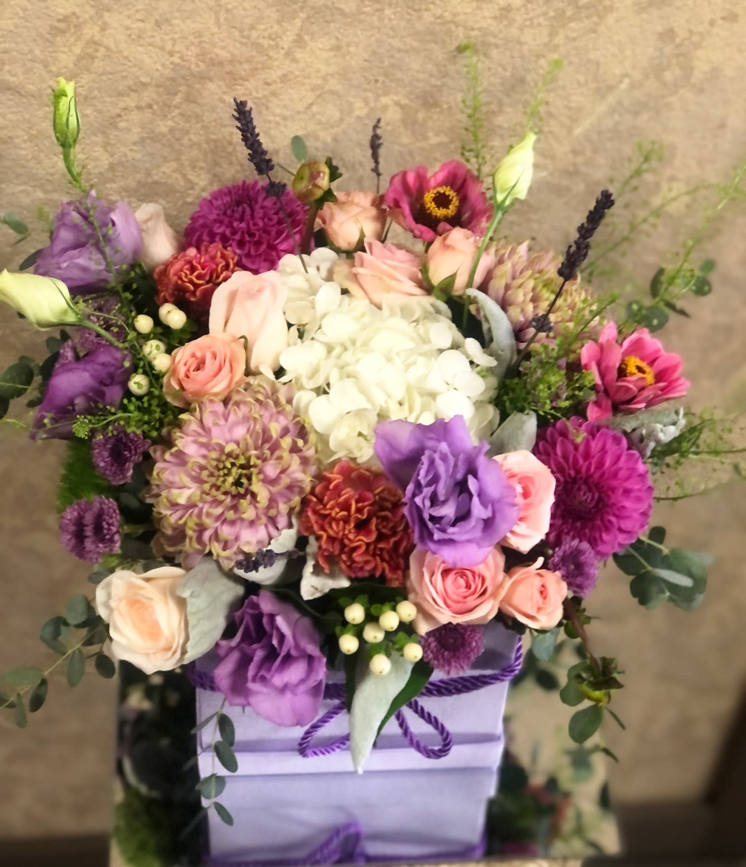 Precious Moments - New joy of life! Send flowers to a mom to celebrate the life of a newborn baby.  Recipe: Hydrangea, Seasonal Anenomes, Roses, Seasonal Zinnia, Spray Roses, Lisianthus, Buttons, and Lavender in a large lavender box. Seasonal: Zinnia (summer to late fall), Anemones (Jan-May, Aug-Dec) Design View: Symmetric Front Facing View Photo shown: Standard 