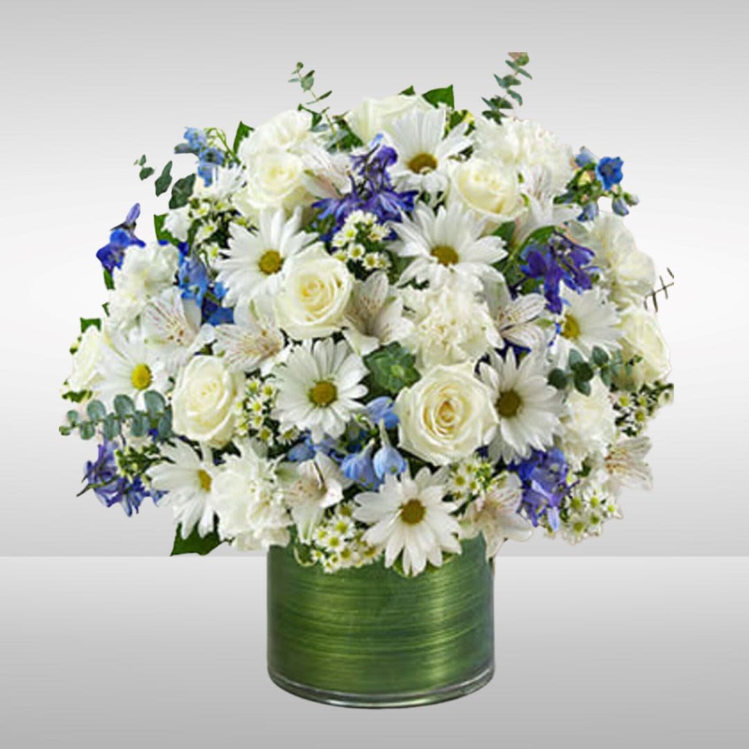 White daisies and roses in a green vase with blue accents