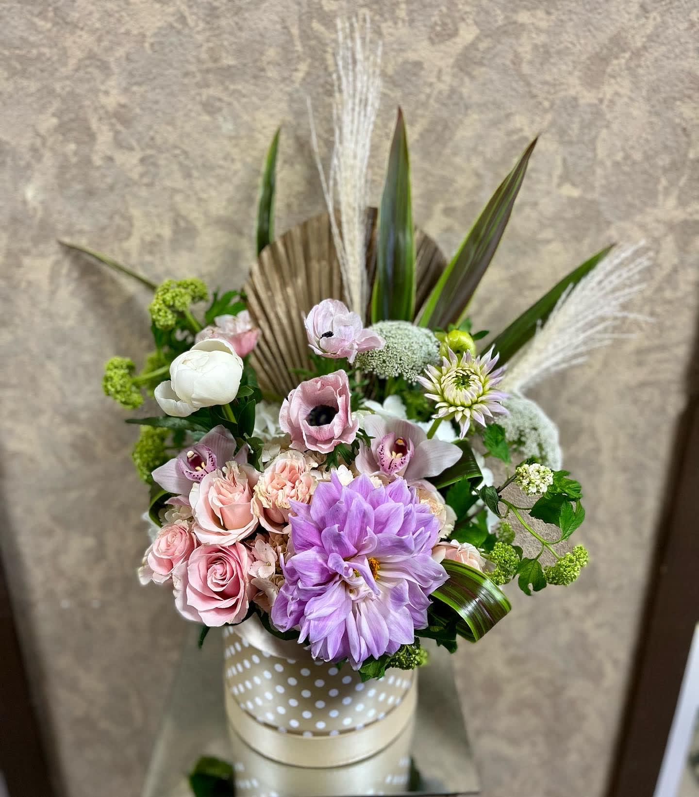 Flourished Antique Floral Box - This design will blow their mind with anemones, roses, dahlias, orchids, peonies and more  in our tan polka dotted box 