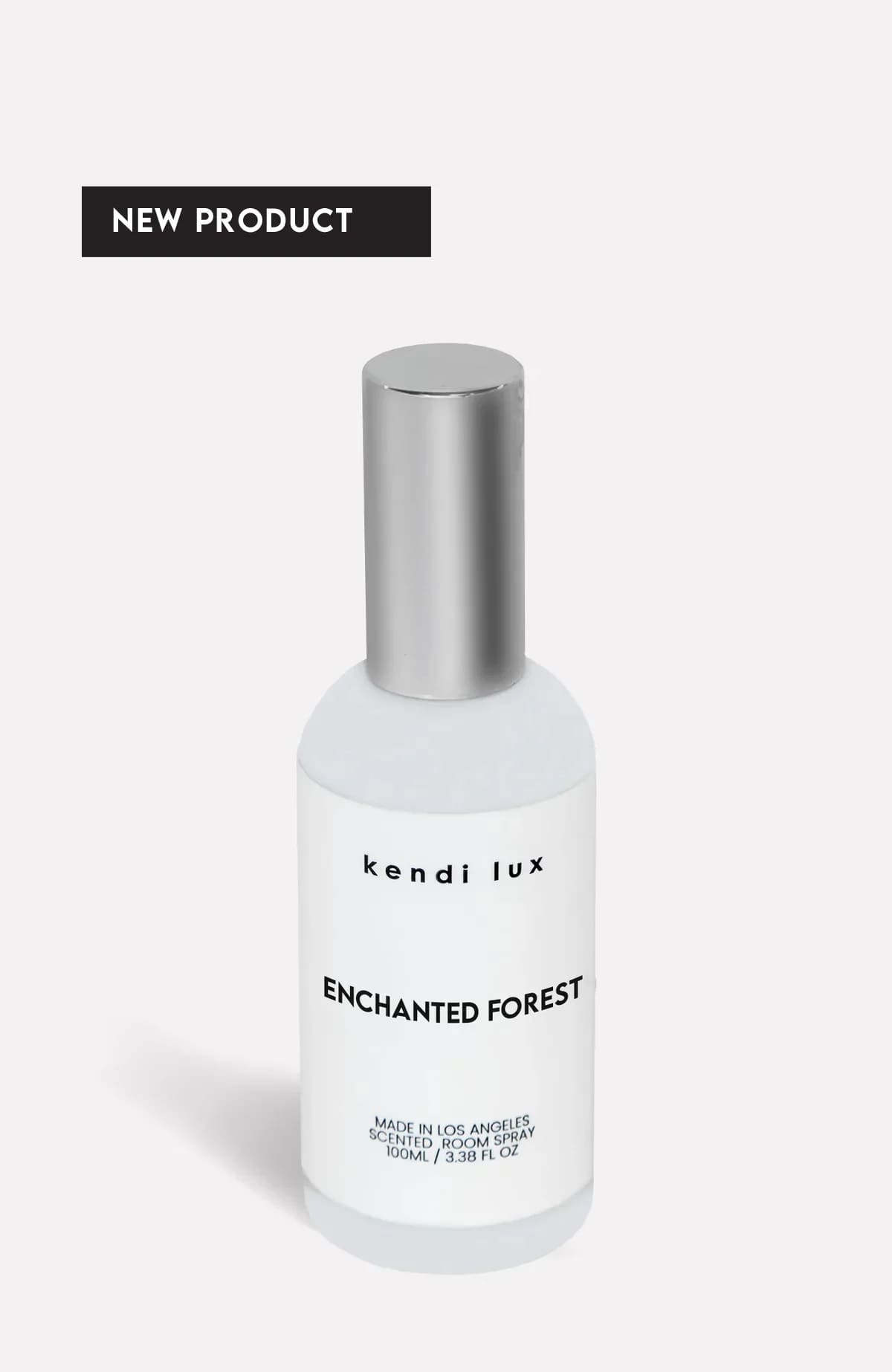 Bottle of scented room spray with a silver cap