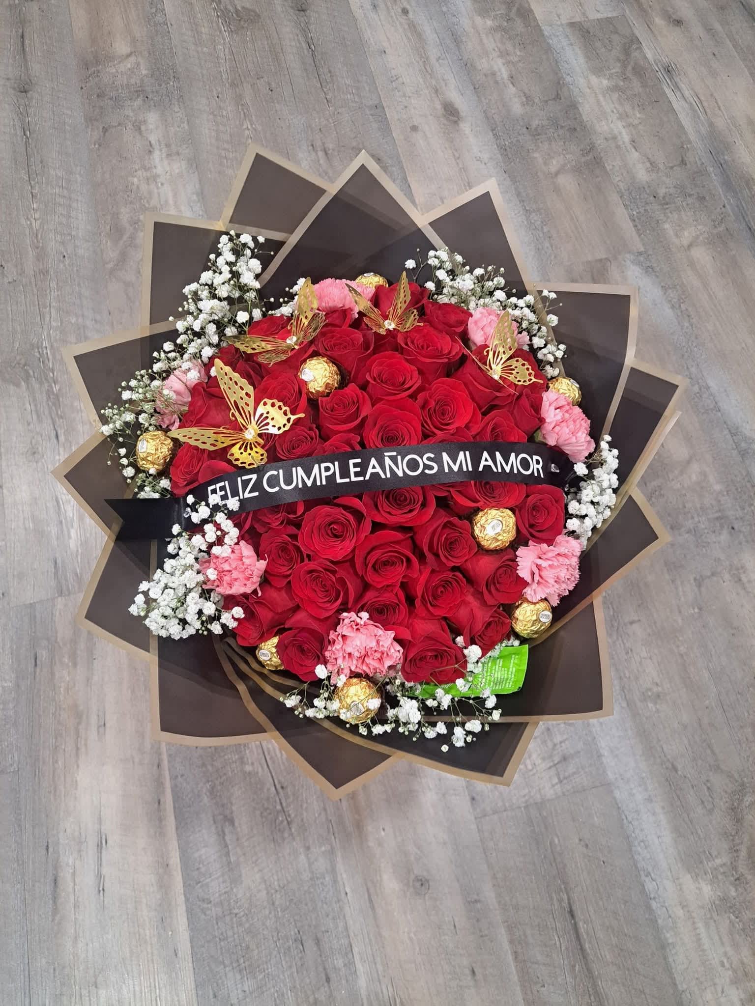 Red roses pink carnations.  - Red roses, chocolate, personalized ribbon and pink carnations.