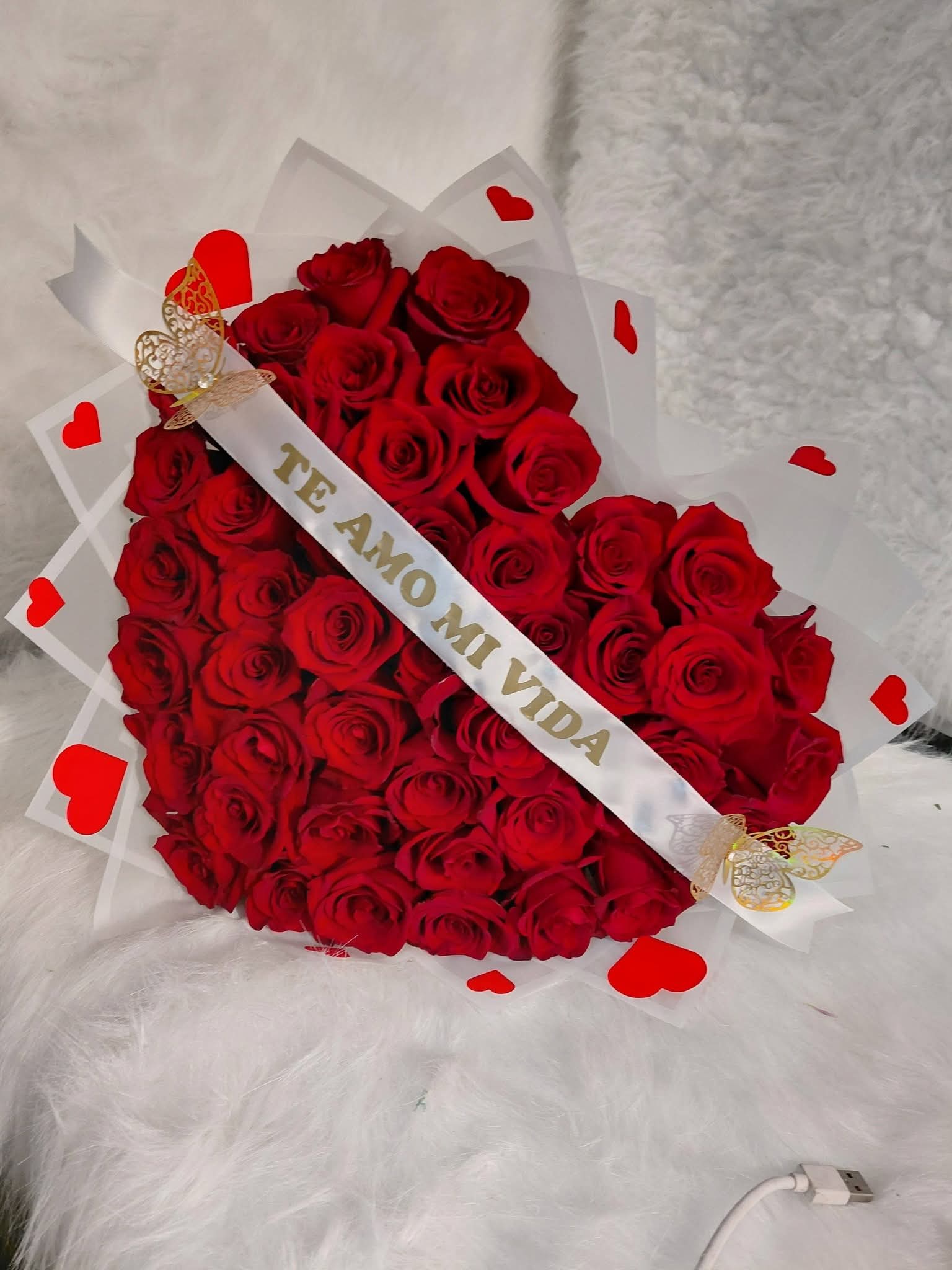 Red hear lovely bouquet.  - A bouquet of red roses in the shape of a heart, with a personalized ribbon and butterflies. A super charming bouquet.