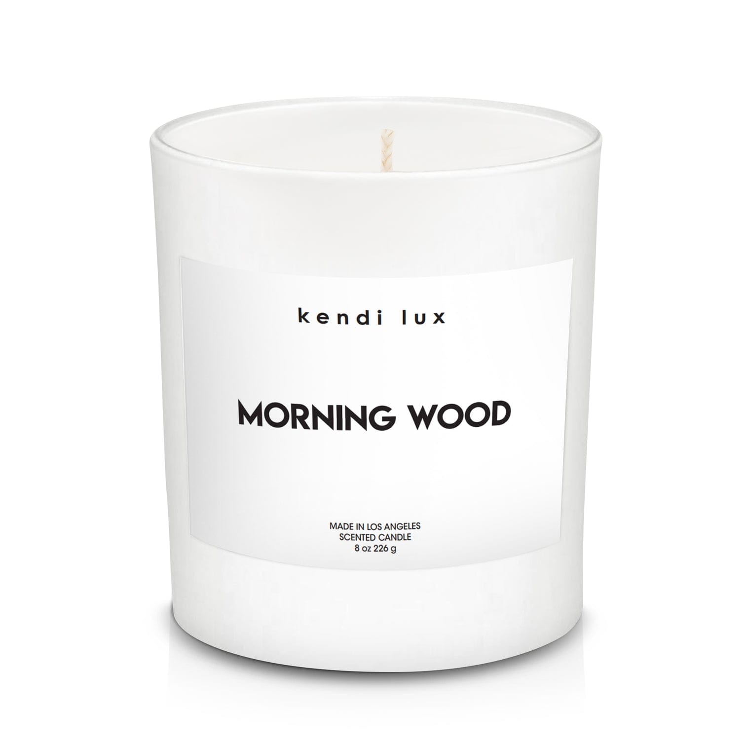 Morning Wood by Kendi Lux - RISE and shine, you know what time it is!  A true embodiment of masculinity, our Morning Wood fragrance exudes aromas that are woodsy, fruity, and sweet — just like your man. Perfect for morning relaxation, or a seductive night. You hold the power with this one…  An intriguing blend of black pepper, fresh ginger, sparkling orange, and grated nutmeg fused with a heart of warm orchid vanilla, richly supported by patchouli, cedar wood, and sandalwood.  Fragrance Details:  Top: Fresh Ginger, Sparkling Orange, Black Pepper  Mid: Grated Nutmeg, Wild Orchid, Sugared Vanilla  Bottom: Shaved Cedar, Patchouli, Sandalwood  Product Details:  Soy blend candle with braided cotton wick in a white glass tumbler. 8.0 ounces (226g). 3.4 inches (8.6cm) tall. Approximately 50 hour burn time.